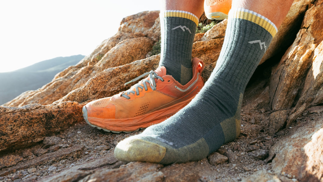 Model wearing the 1466 Spruce with back foot in orange sneaker