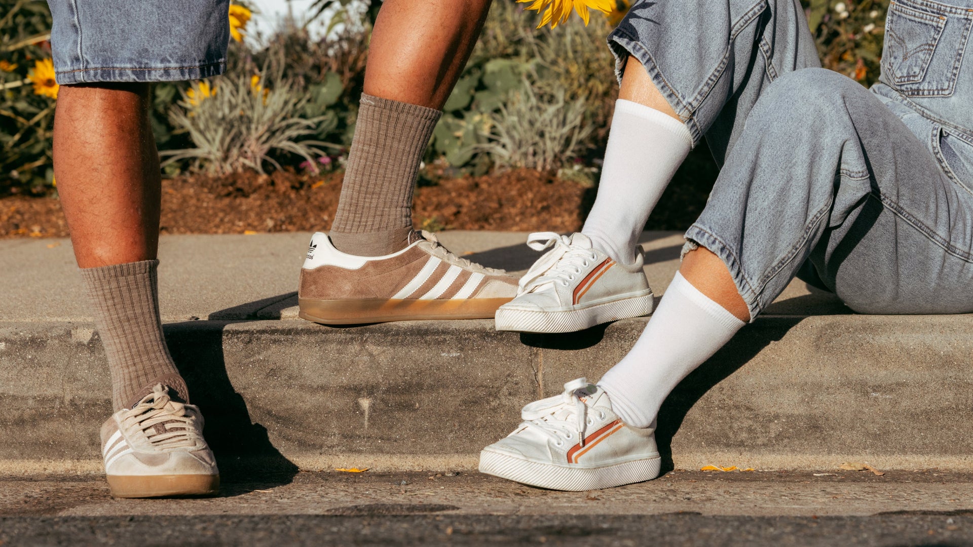 Two models on curb wearing the Standard crew in Rye and white