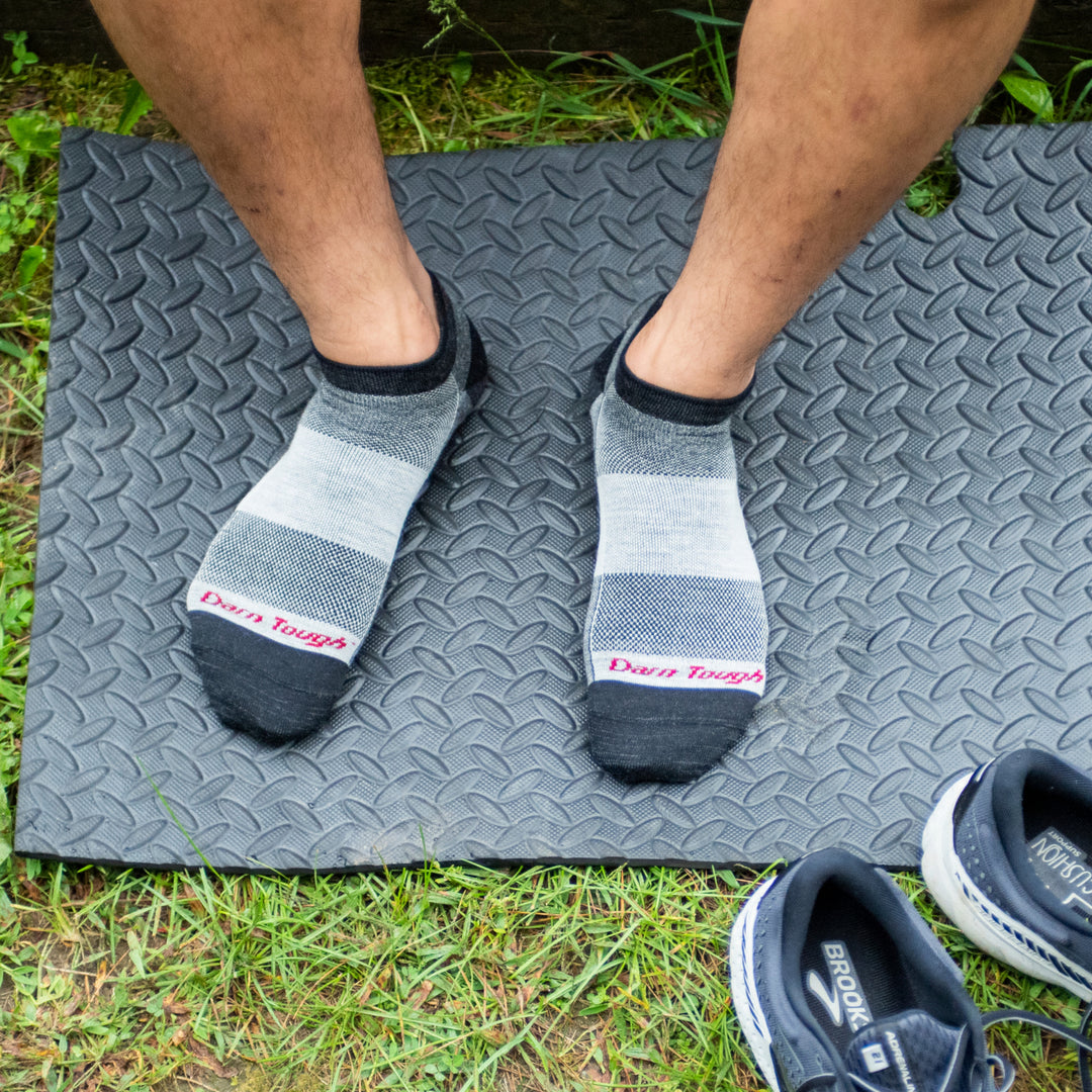 Athlete standing on yoga matt wearing 1437 no show athletic socks