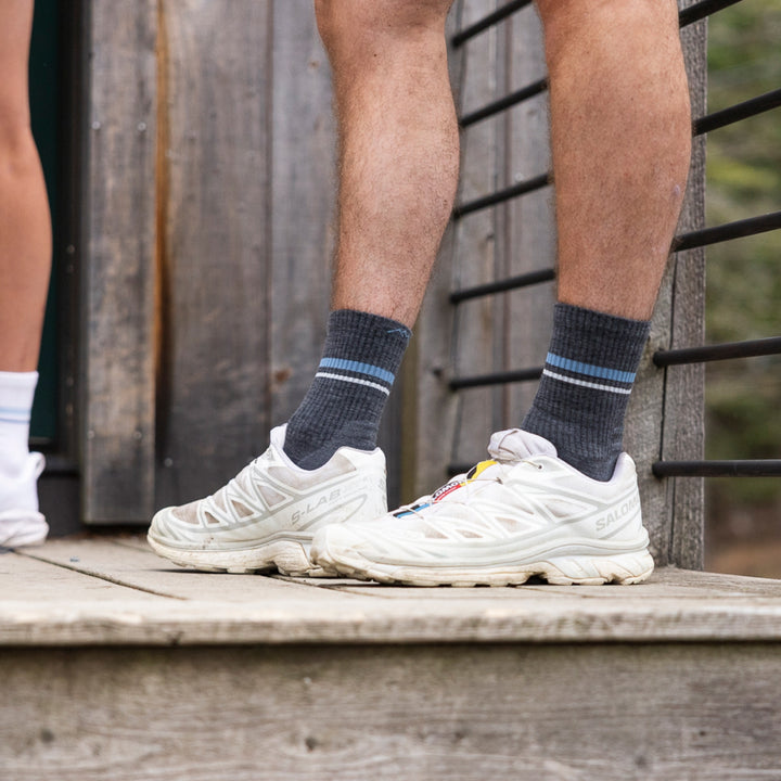close up image of models legs wearing white hiking shoes and 1118 element micro crew lightweight with cushion gray sock