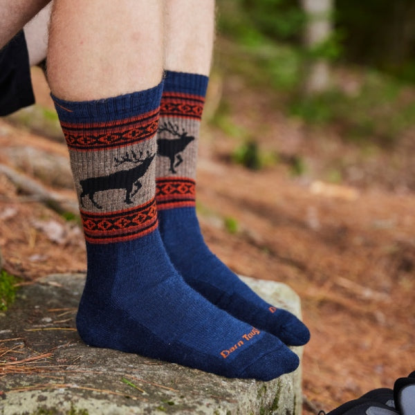 Models feet on the rock wearing the 1980 Eclipse with Elk on the cuff