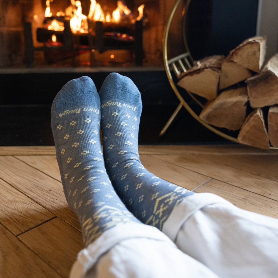 models feet in front of a fire wearing 6088 Light denim featuring a blue body and cream design 