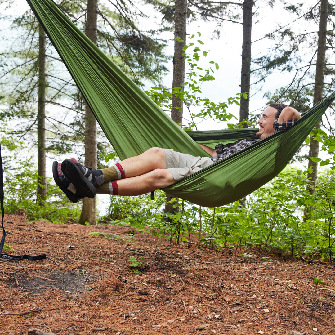 model laying in a hammock wearing the 1924 ash with sandals