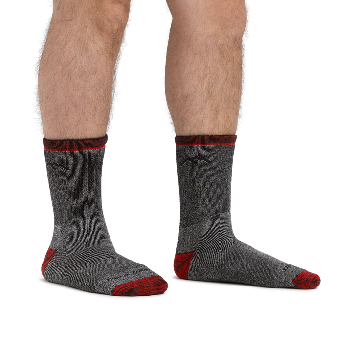 Man standing barefoot wearing Mountaineering Micro Crew Heavyweight Hiking Socks in Smoke