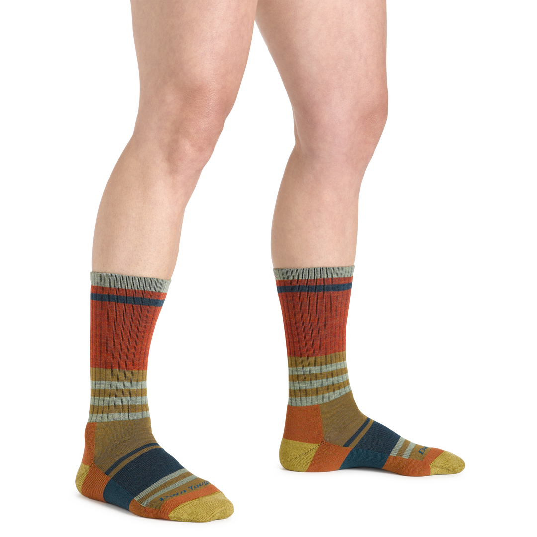 Image of a woman's legs on a white background, wearing Women's Her Spur Boot Lightweight Hiking Socks in Sandstone