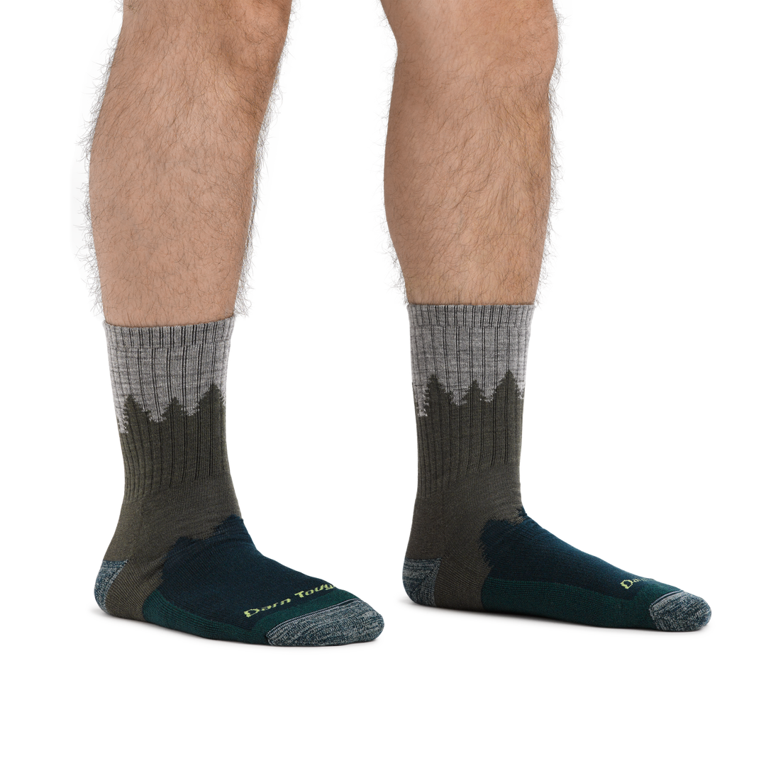 Man standing barefoot wearing Number 2 Micro Crew Hiking Socks in Green