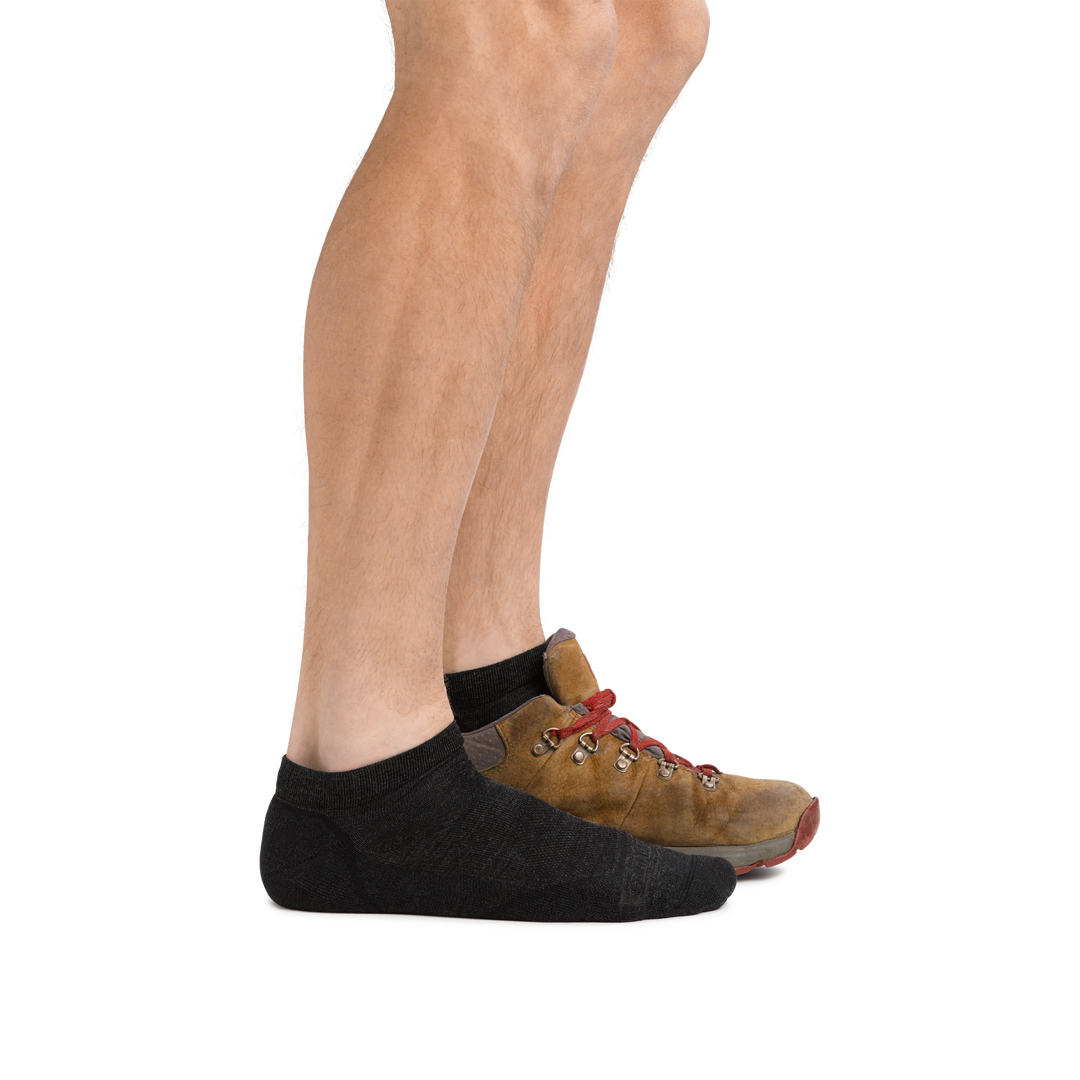 Man wearing Light Hiker No Show Lightweight Hiking Socks in Black and back foot also in a hiking boot