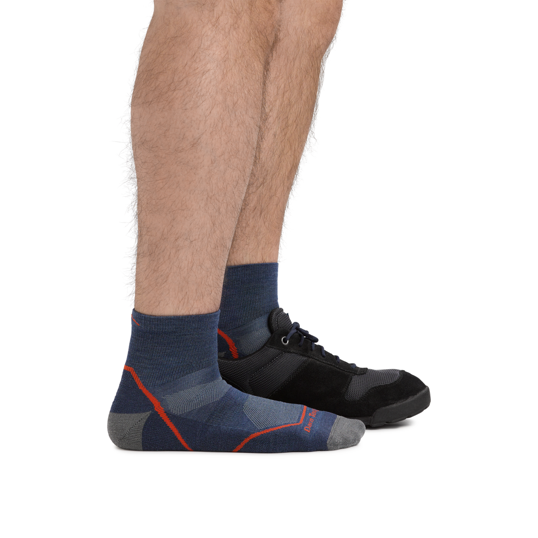 Male legs facing right wearing Light Hiker Quarter Lightweight Hiking Socks in Denim with back foot in a sneaker