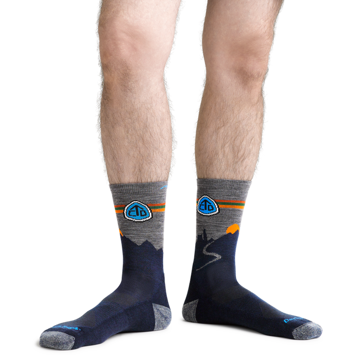 CDT Hiking Socks in Eclipse on foot showing logo