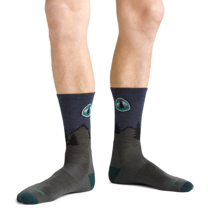 PCT Hiking Socks in Forest on foot showing logo