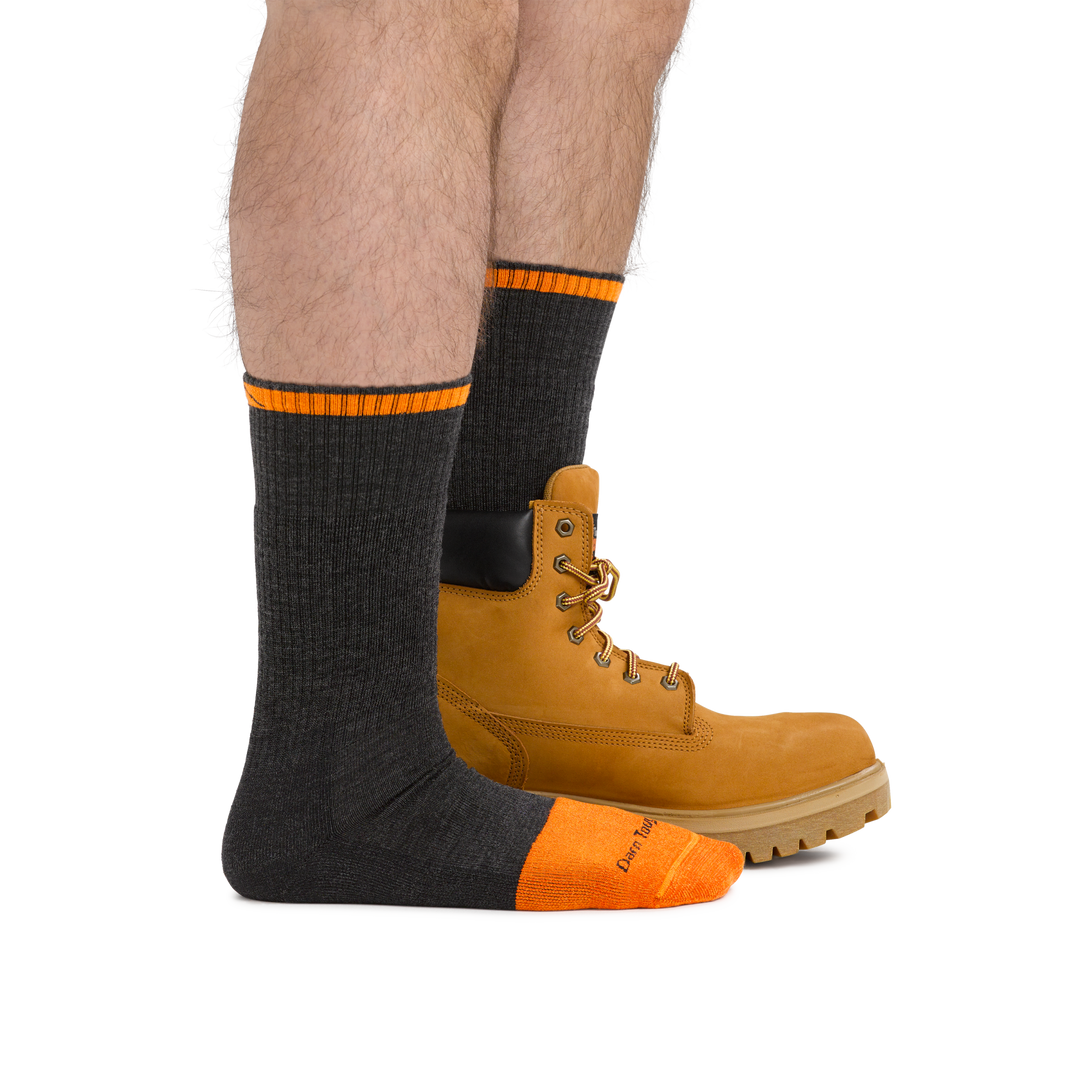 Man wearing Steely Boot Midweight Work Sock in Graphite, back foot also wearing a work boot