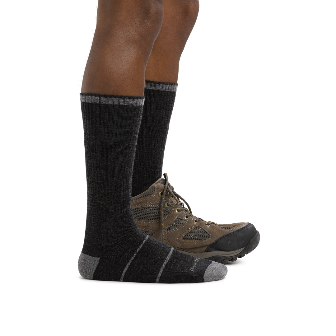 Man's facing right, wearing William Jarvis Boot Midweight Work Sock in Gravel with back foot also wearing a hiking boot