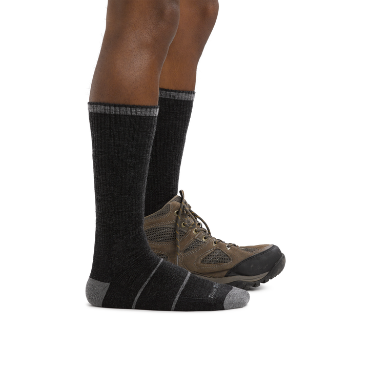 Man's facing right, wearing William Jarvis Boot Midweight Work Sock in Gravel with back foot also wearing a hiking boot