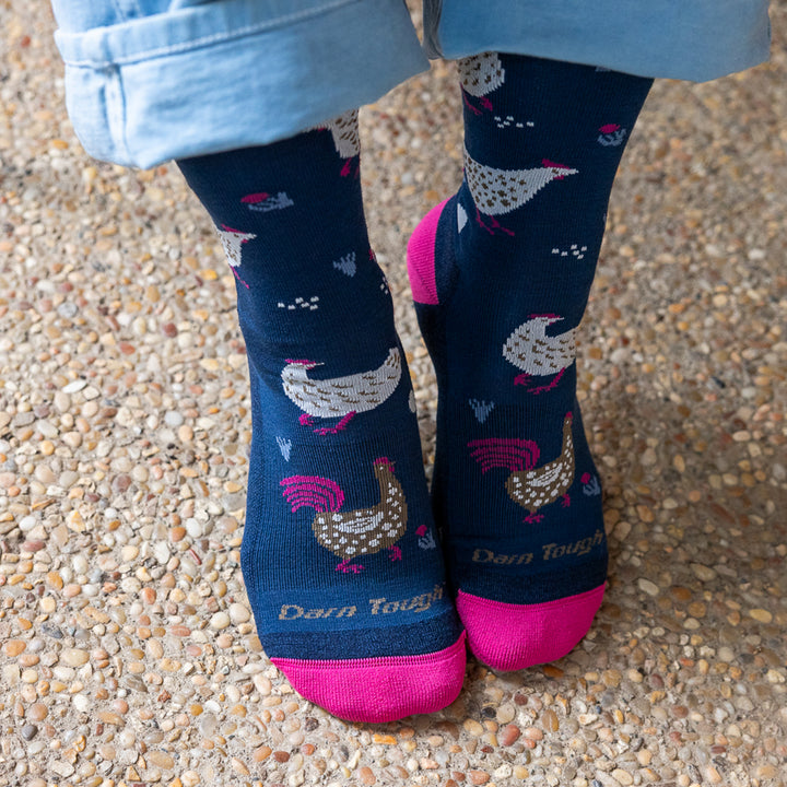 close up of models feet wearing the 6114 mother clucker lightweight lifestyle crew sock in limited edition color midnight