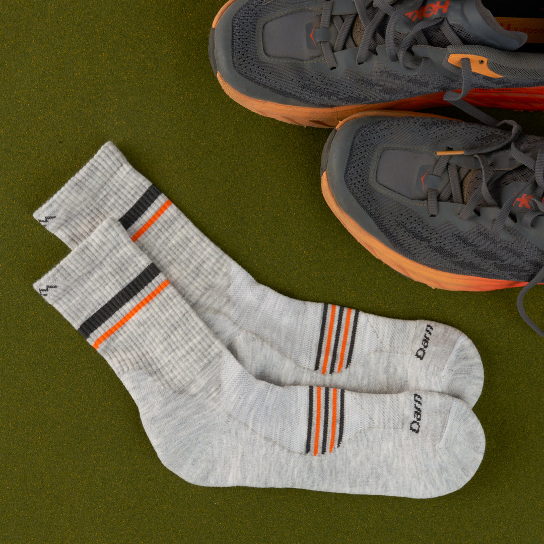 A pair of 1118 Element Micro Crew in Limited edition colorway Ash featuring a navy and orange stripe on the foot and calf