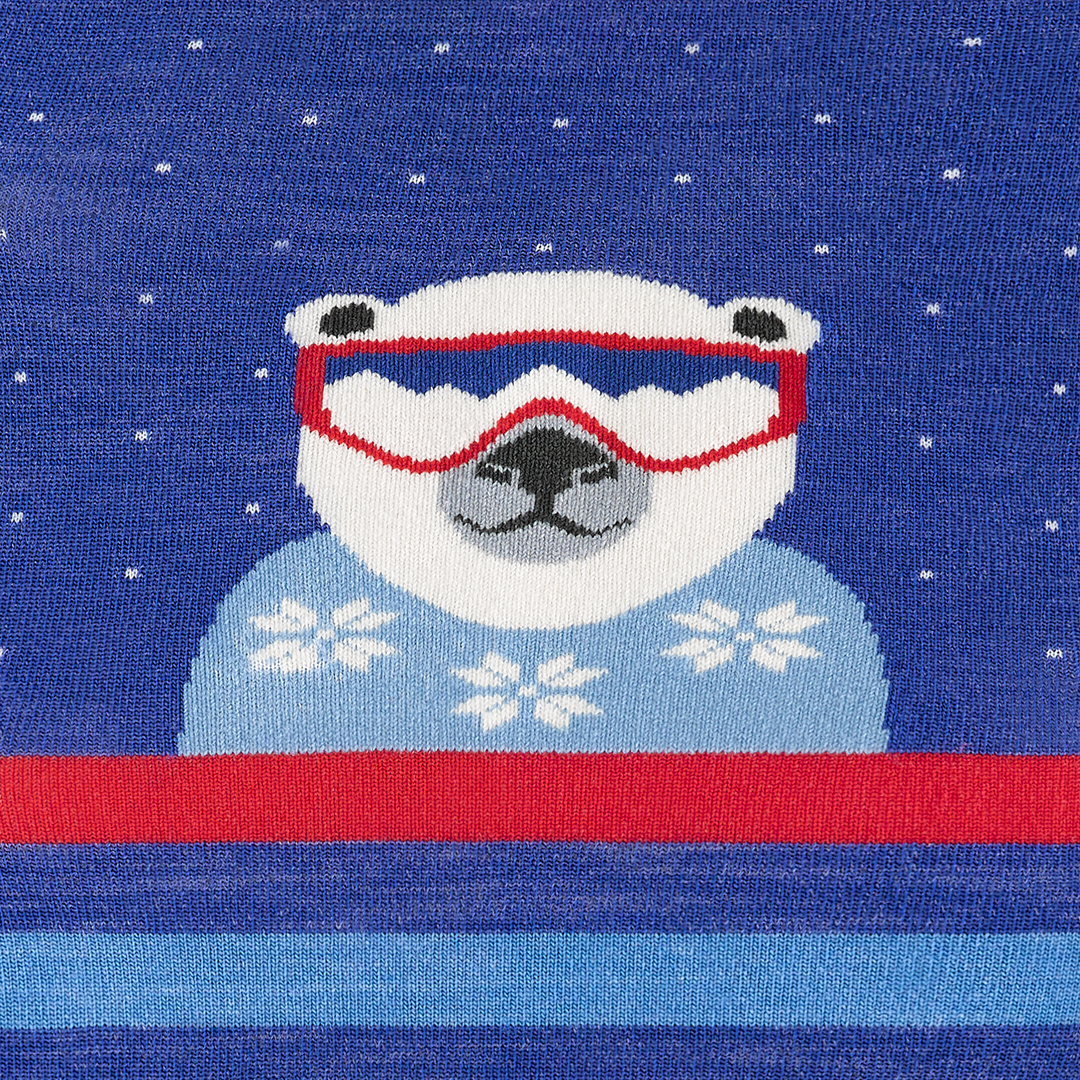 Kid's polar patroller over-the-calf snow sock in marine blue with a white polar bear wearing red snow goggles