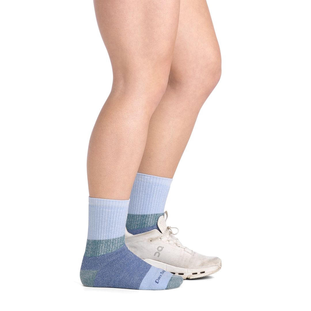 on model image side view shoe on back foot wearing the 3045 hill topper micro crew sock in Dragonfly colorway
