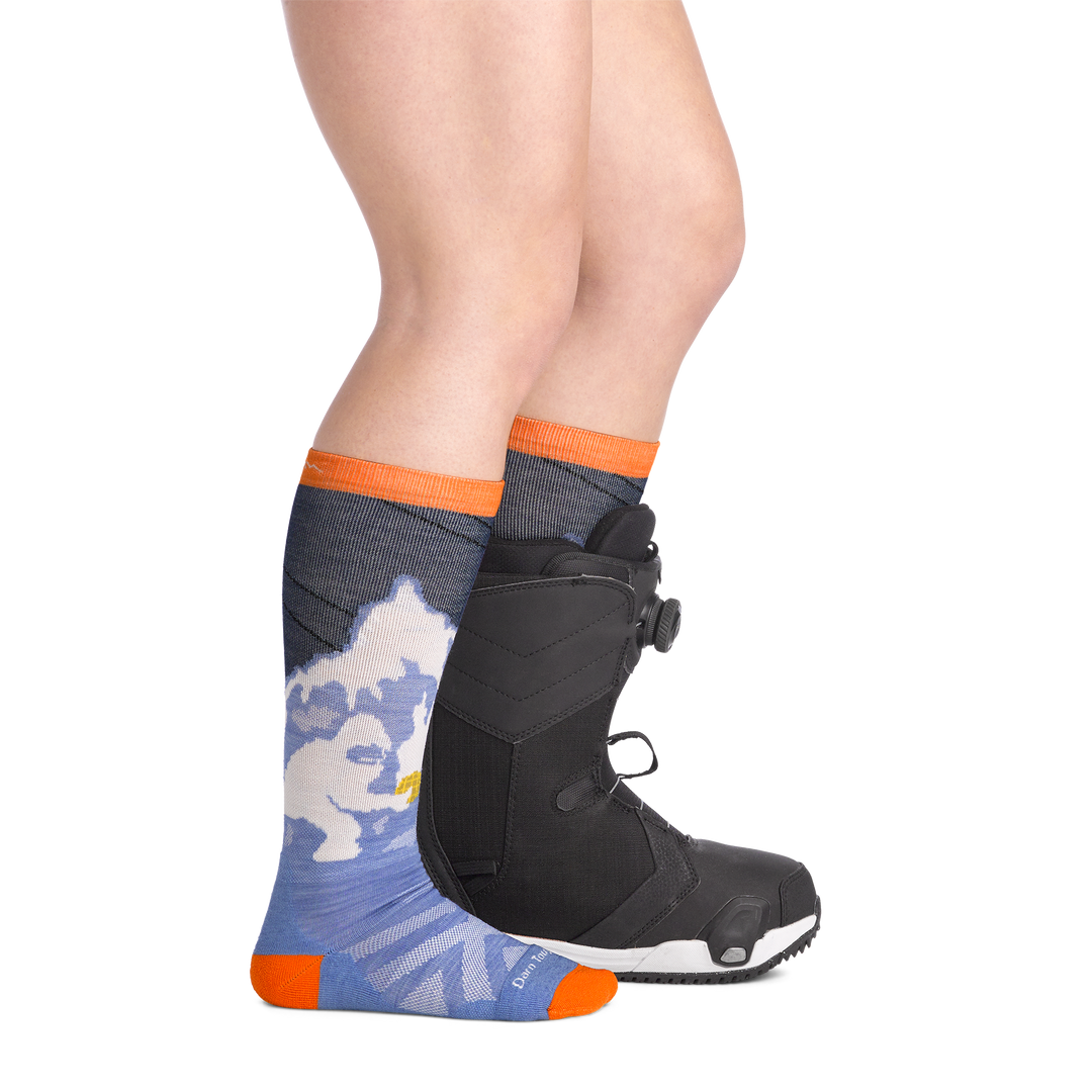 on model image side view back foot in boot wearing the 3809 little yeti over the calf sock in midnight colorway
