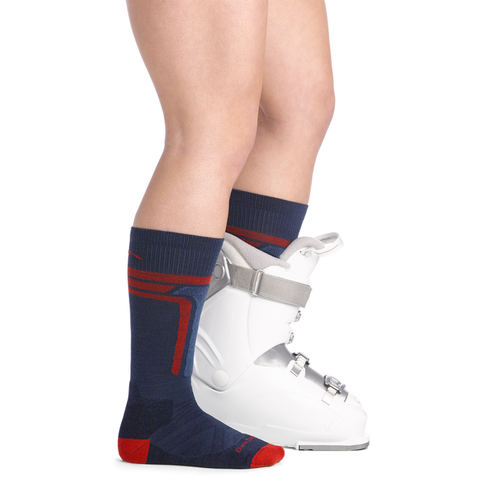 on model image side view with back foot in boot wearing the 3810 T-Bar over the calf sock in Midnight