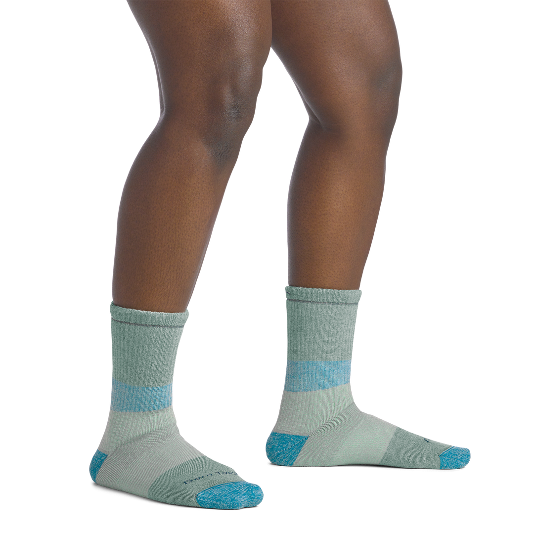 on model image bare foot wearing the 5011 micro crew mountaineering sock in reed colorway