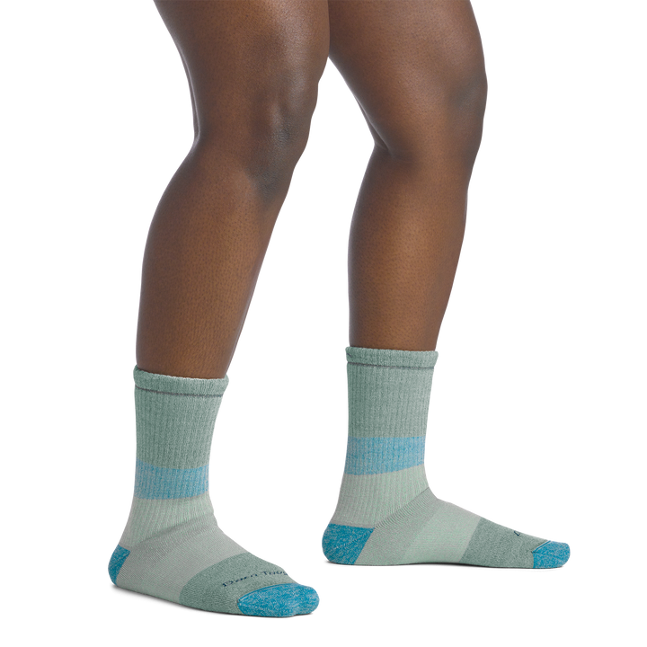 on model image bare foot wearing the 5011 micro crew mountaineering sock in reed colorway