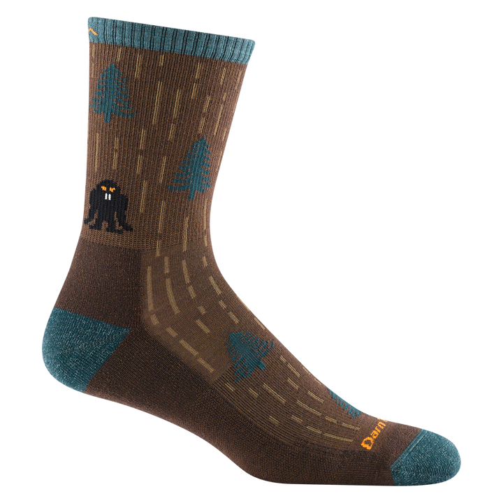 5015 Yarn goblin in Earth featuring teal heel/toe/cuff a brown body with teal trees and a black goblin