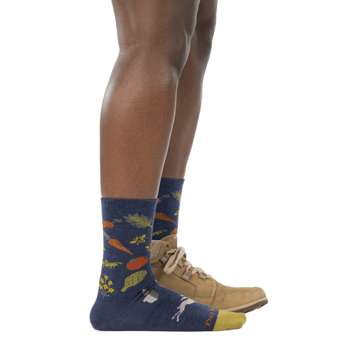 model wearing hiking boot on back foot and 6054 indigo crew lightweight sock side profile