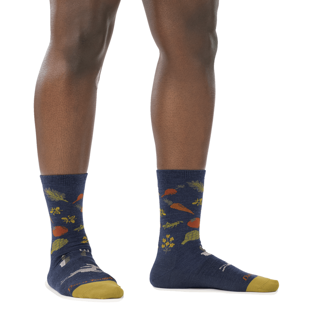 on model image of woman barefoot in staggered stance wearing 6054 indigo crew lightweight sock