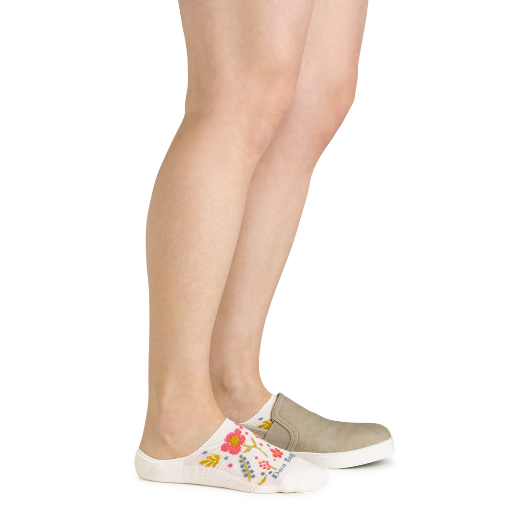 Model wearing the women's garden party no show hidden lifestyle sock in white with a tan shoe on her left foot