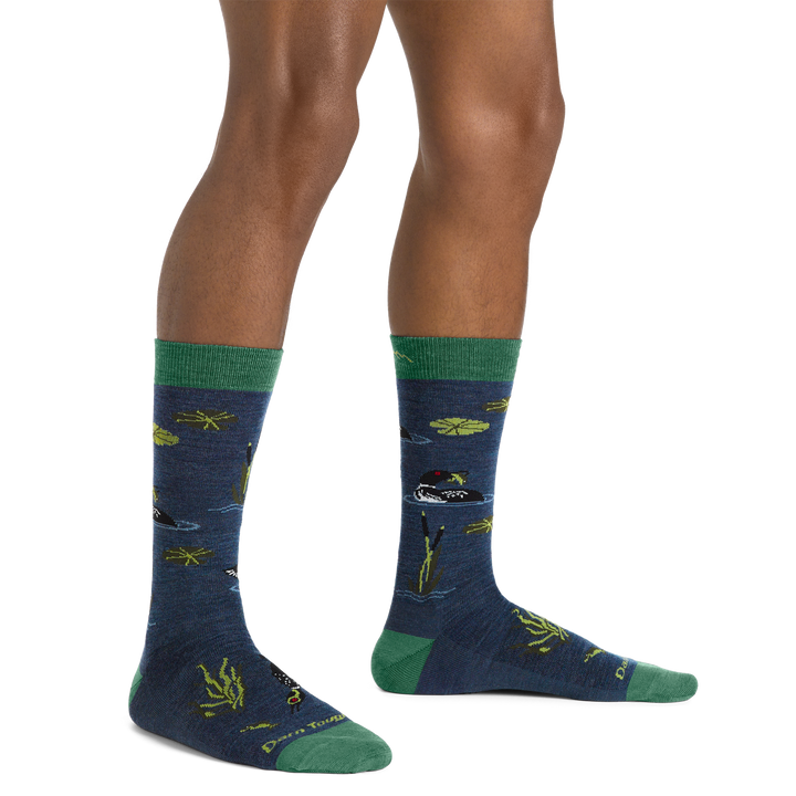 Side studio shot of model wearing men's diver crew lifestyle sock in denim