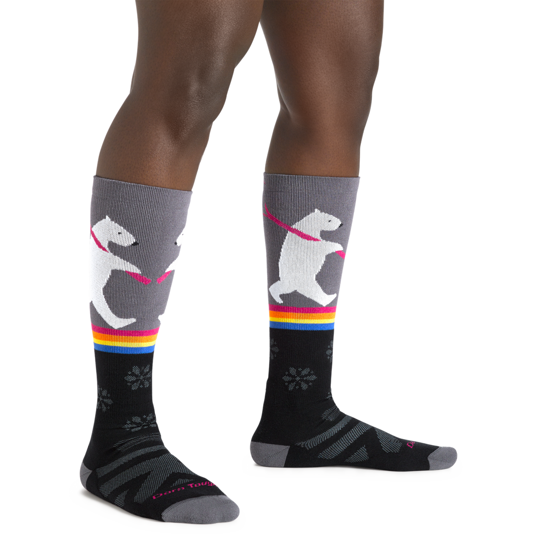 Image of a woman's legs, wearing Women's Due North Over the Calf Midweight Ski and Snowboard Socks in Black
