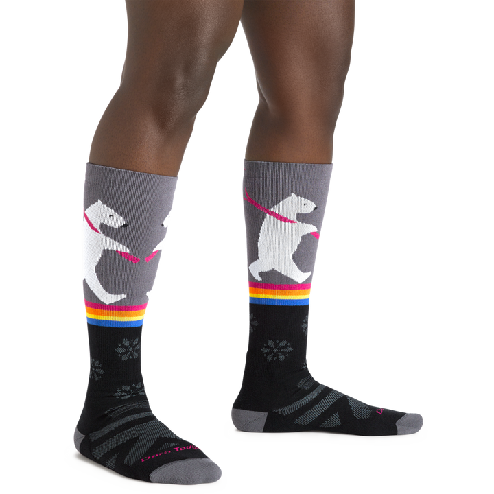 Image of a woman's legs, wearing Women's Due North Over the Calf Midweight Ski and Snowboard Socks in Black