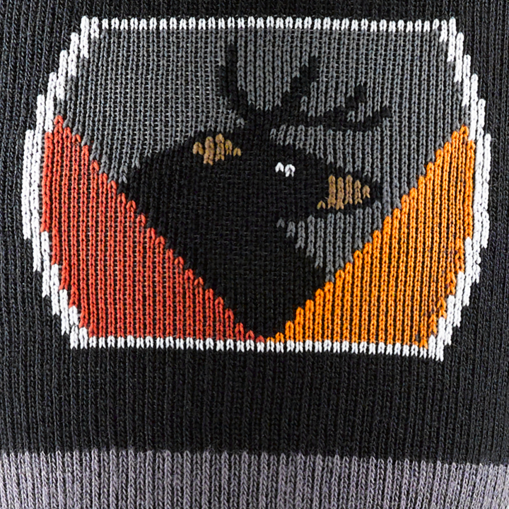 Call out detail image of the of the 8045 black front image of bear with deer horns badge style