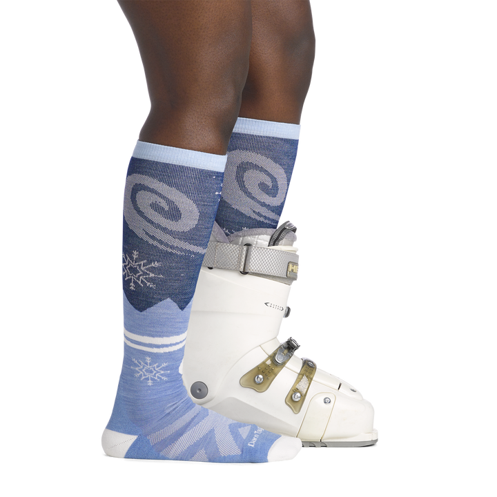 on model image side view back foot in boot wearing the 8054 swirlwind over the calf in midnight colorway