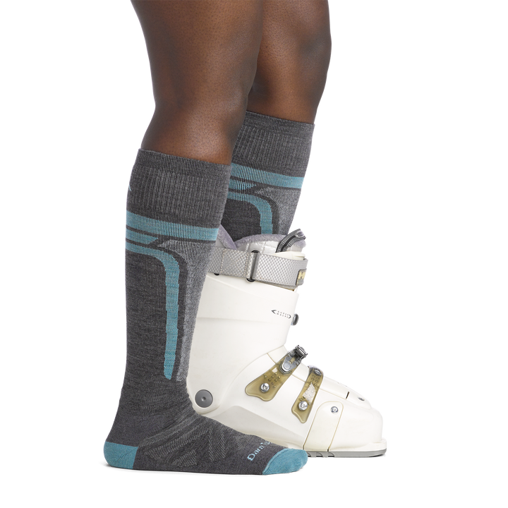 on model image side view back foot in boot wearing the 8057 edge over the calf sock in gray colorway