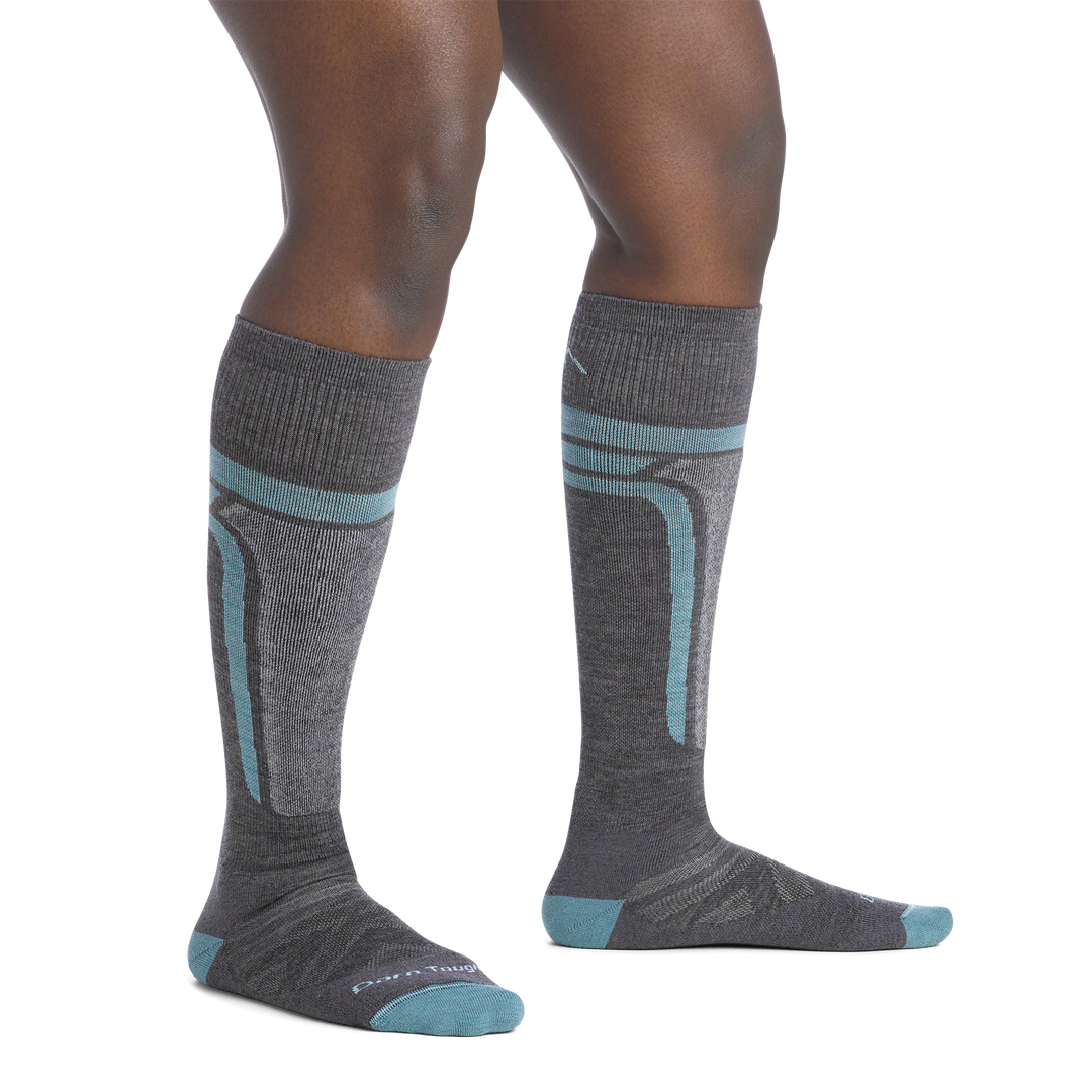 on model image bare foot wearing the 8057 edge over the calf in gray colorway
