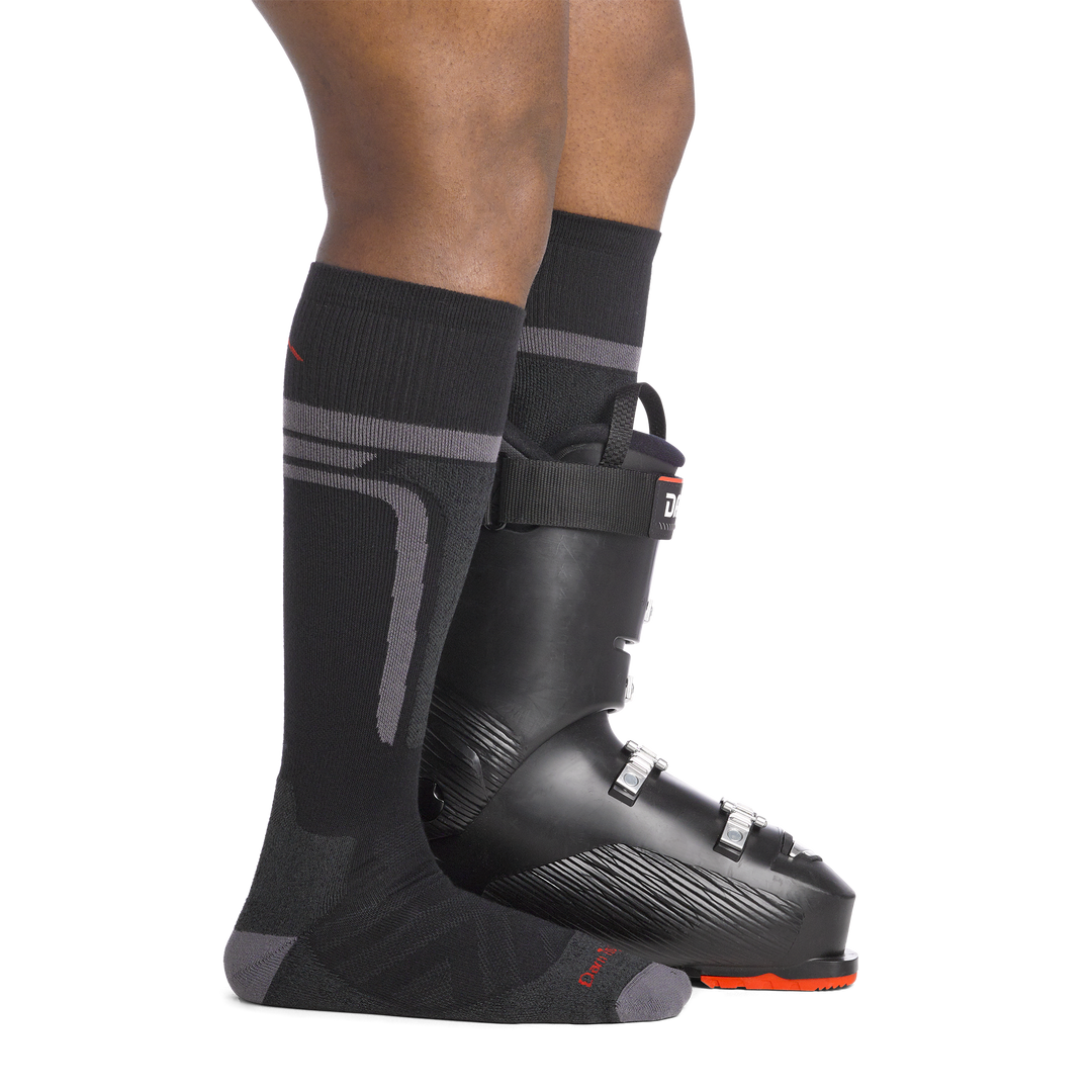 on model image side view back foot in boot wearing the 8058 thermolite edge over the calf sock in black colorway