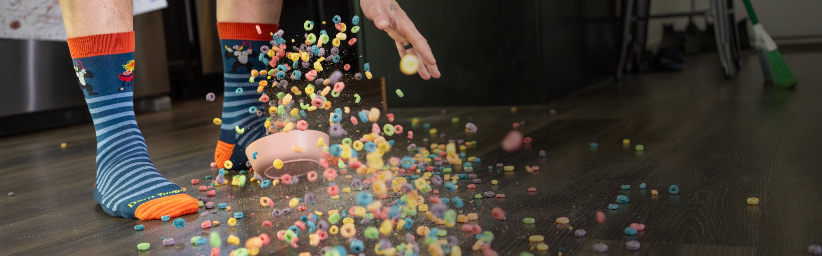 Low angle shot of a dad's feet surrounded by spilled milk and fruit loops from a toddler bowl