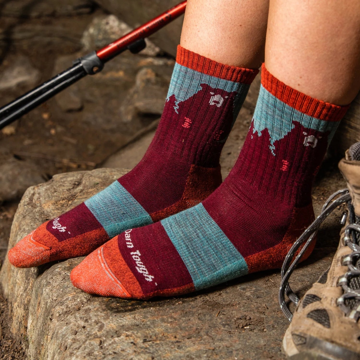 Model wearing the women's bear town micro crew hiking socks in cranberry