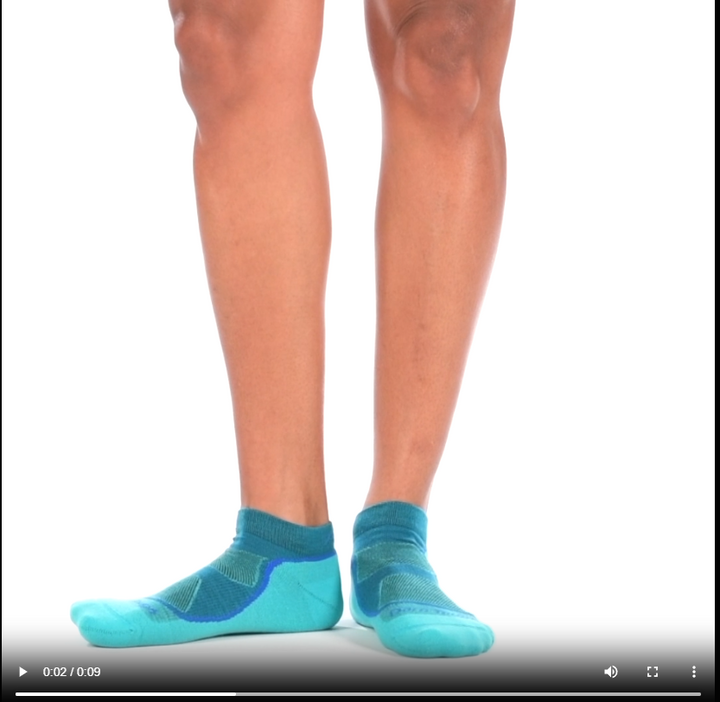 Video of model wearing Light hiker no-show socks in cascade, rotating around to show the fit of the socks.