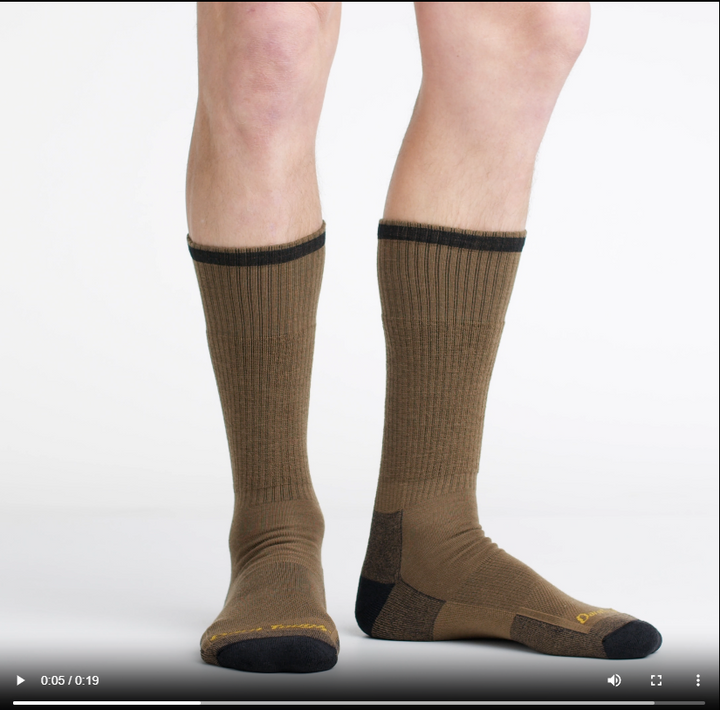 Video of model wearing john henry boot sock in timber, rotating the feet to show the fit.