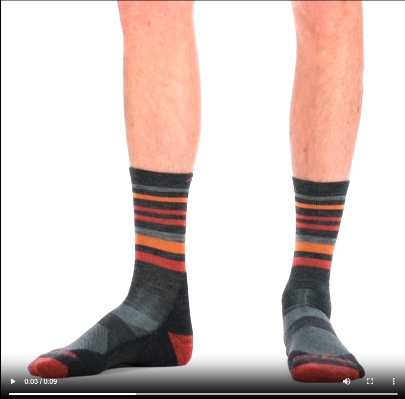 Video of model wearing Fastpack Micro crew socks in charcoal, rotating around to show the fit of the socks.