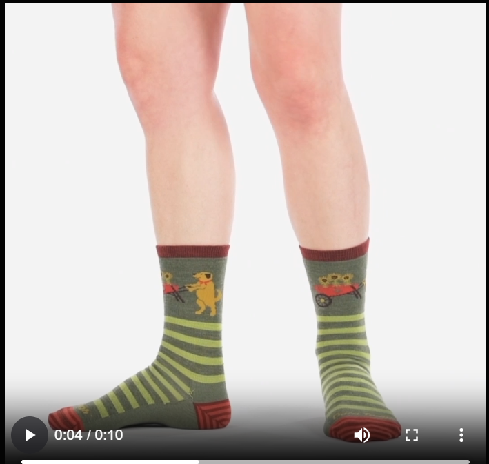 Video of model wearing women's animal haus crew socks in Herb green, walking around to show all angles of the socks.