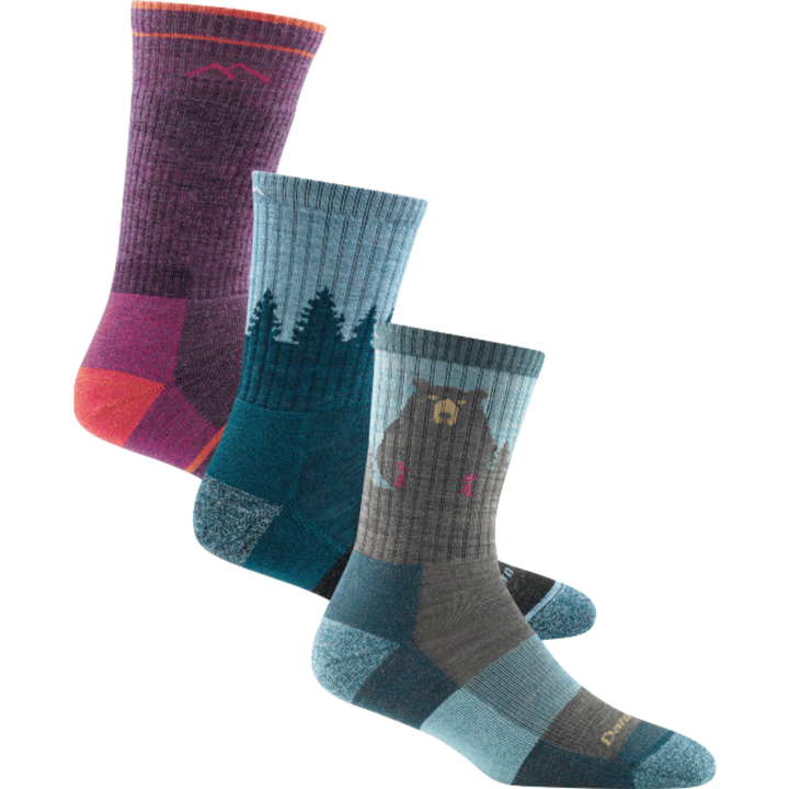 3 pack hiking bundle shot including the women's boot sock in plum heather, the women's treeline micro crew sock in blue, and the women's bear town micro crew sock in aqua