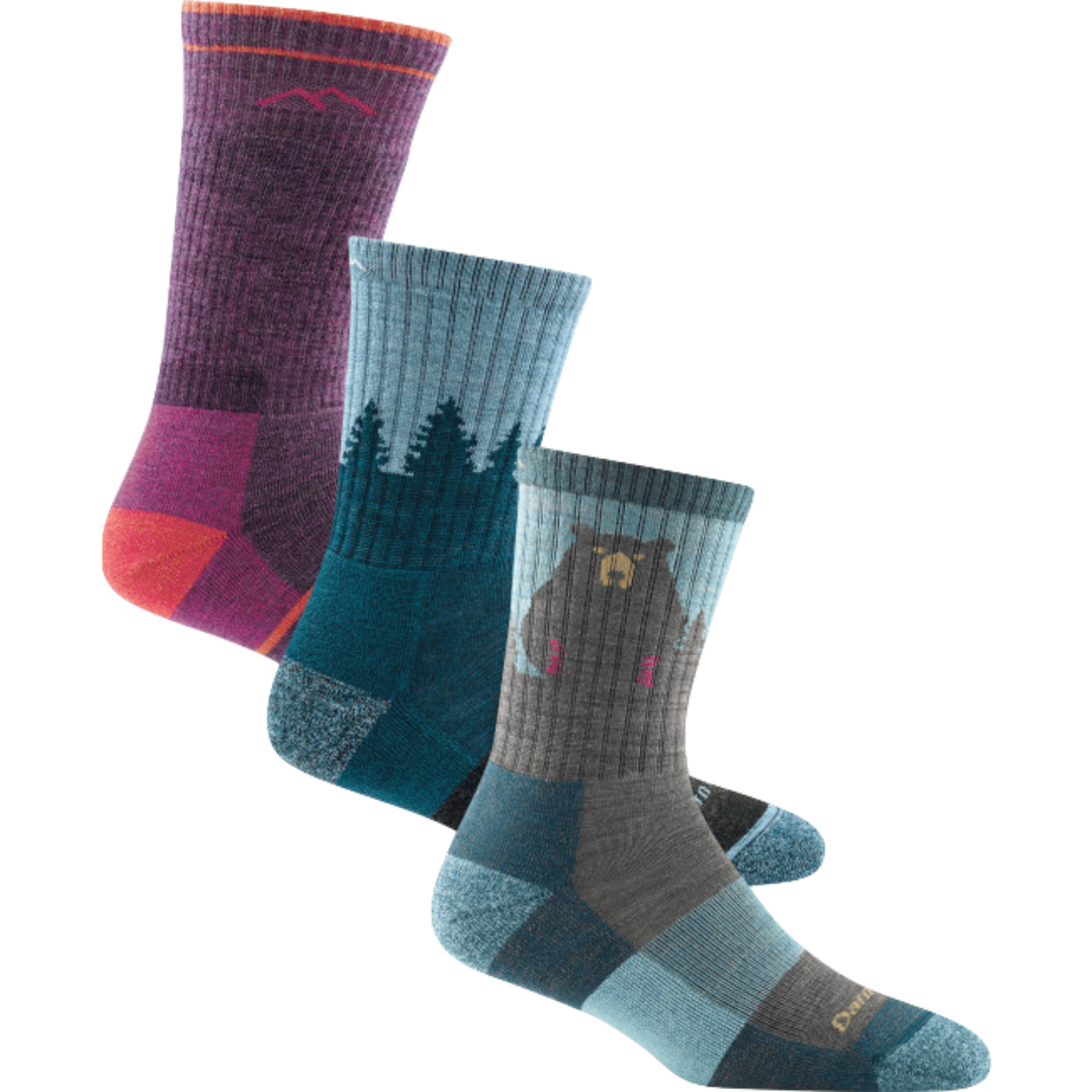 3 pack hiking bundle shot including the women's boot sock in plum heather, the women's treeline micro crew sock in blue, and the women's bear town micro crew sock in aqua